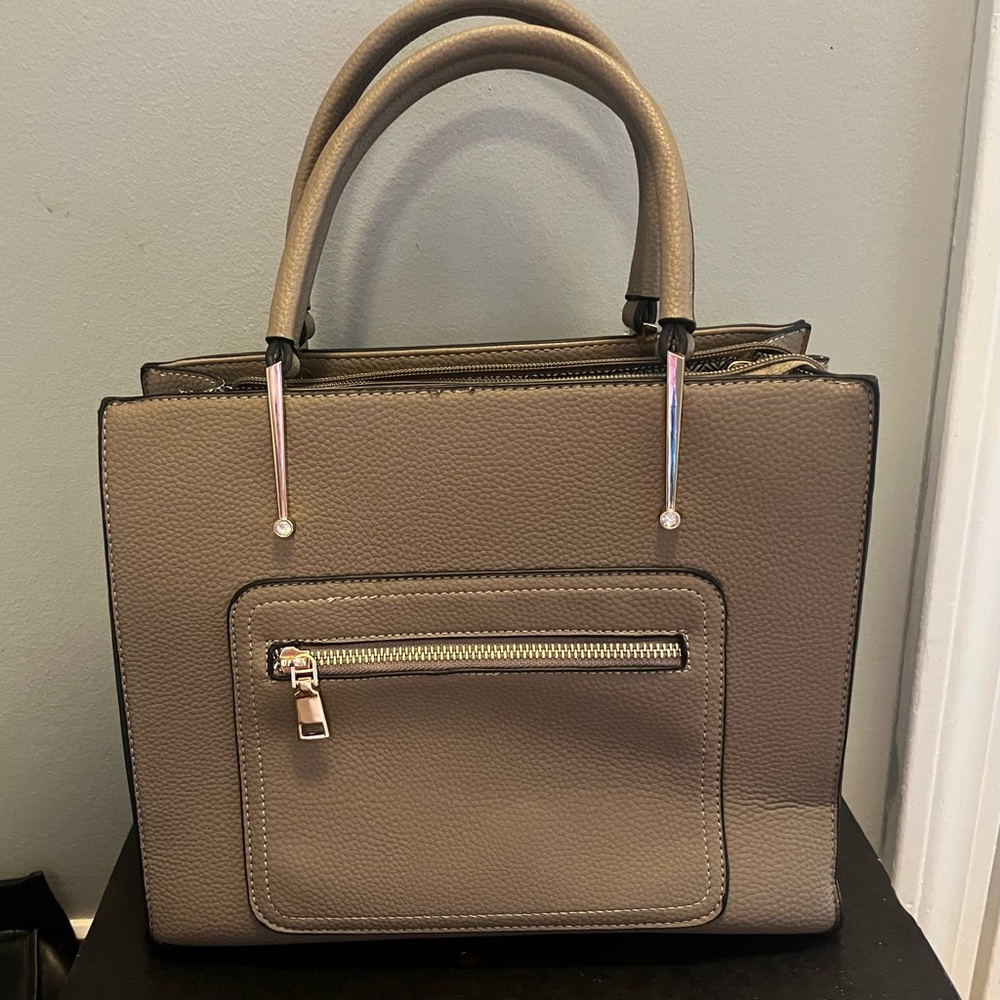 tan purse wrist bag